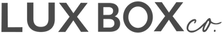 The image features the logo of LUX BOX co., a distinguished gifting company, with bold black letters on a transparent background.